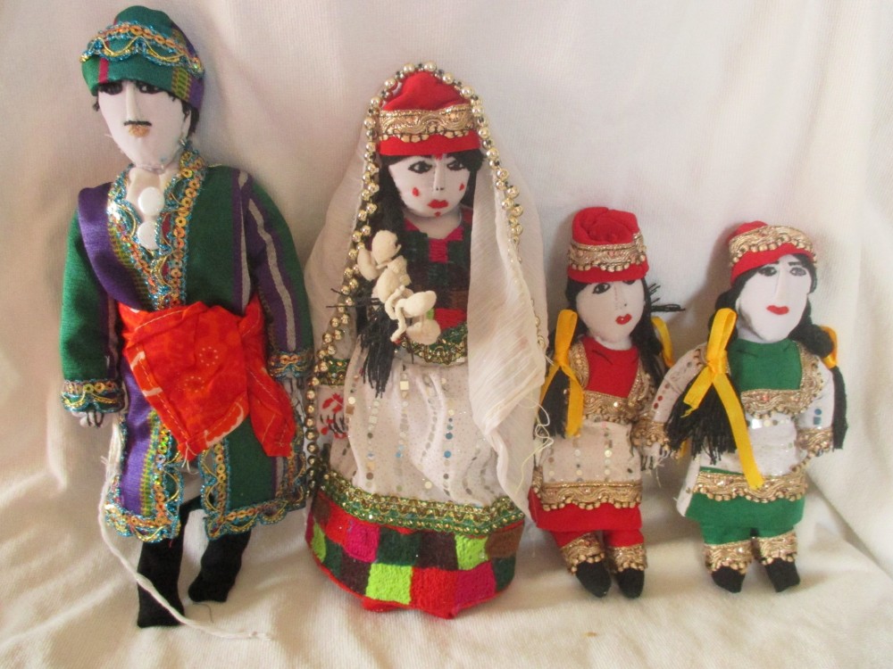Turkmen Husband and wife with two daughters wearing Turkmen Koynek dress and Taqia and Bashboghi hats
